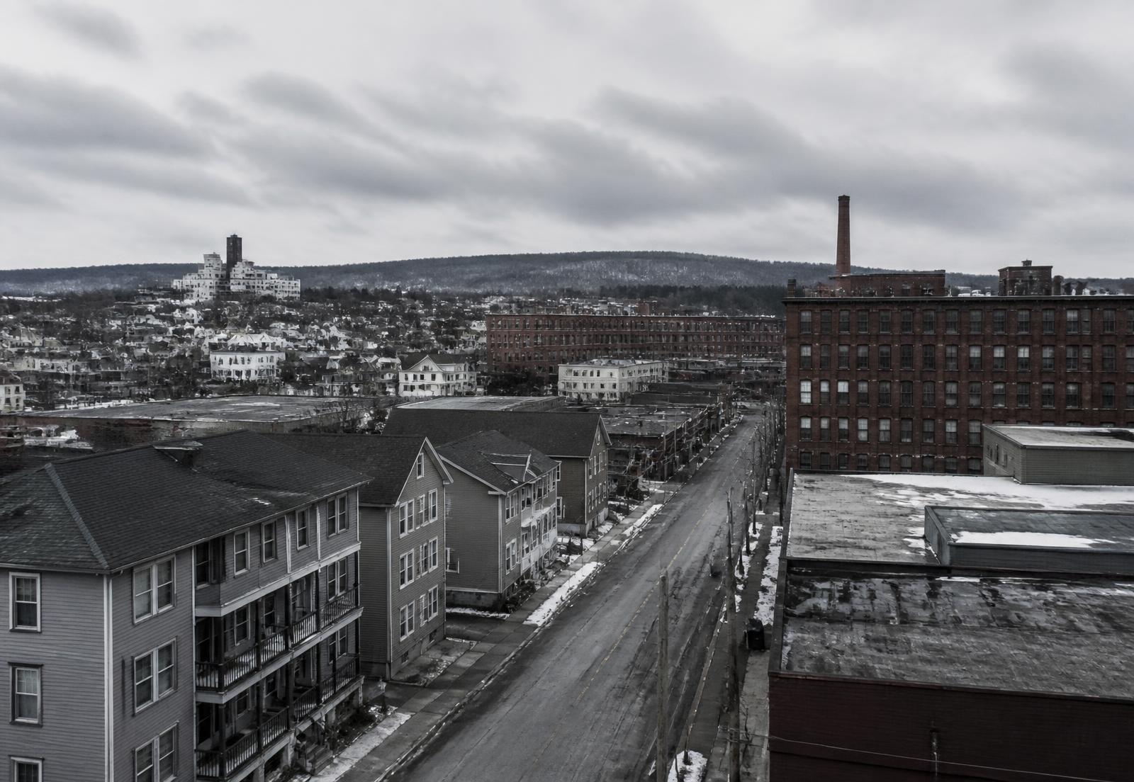 Industrial streetscape and river valley in an Upstate New York city